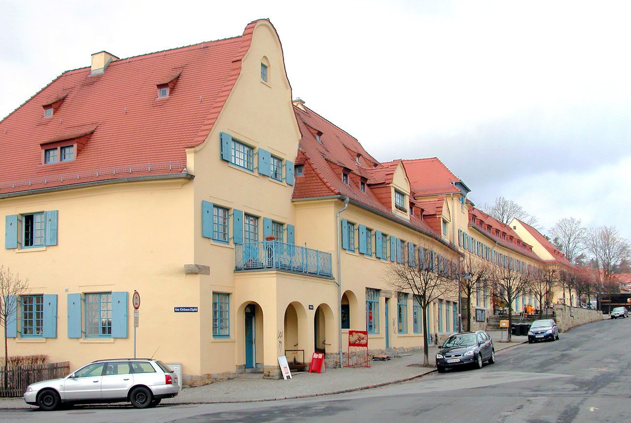 Wohnsiedlung mit Grünflächen, Symbolbild zur Gartenstadt-Idee im Städtebau